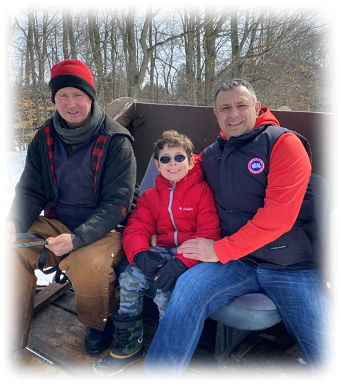 Tom Batsos, son and local farmer on horse drawn carriage